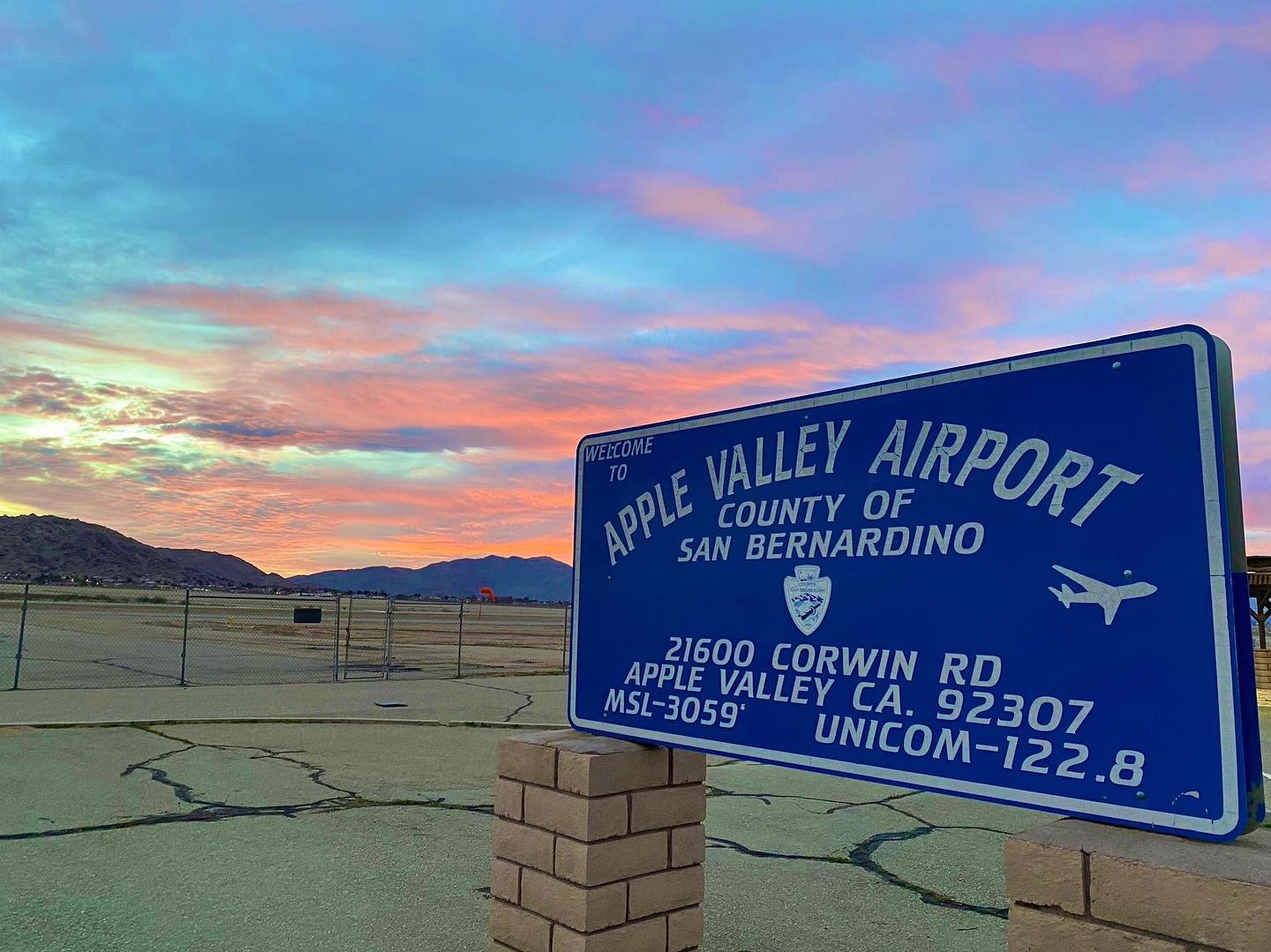 Apple Valley Airport sign with beautiful sunrise 