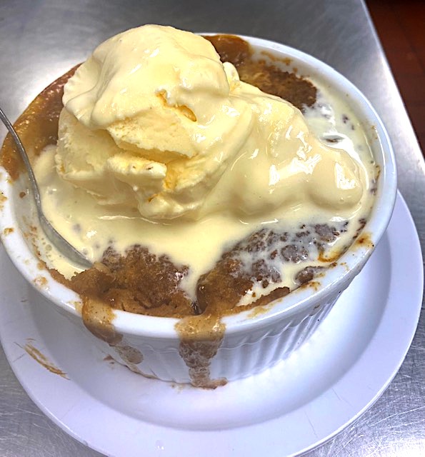 Fruit cobbler with melting ice cream